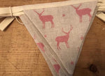 Handmade Bunting in Peony and Sage Stags with a plain natural linen reverse