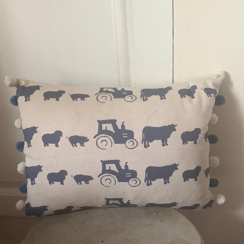 Fabulous oblong cushion in Farm fabric by Norford Designs with navy Pom poms
